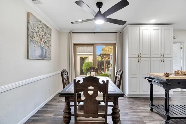 a view of a dining room with furniture window and wooden floor