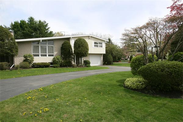7 Grace Road Newton, MA 02459 - Photo 1 of 9 a front view of a house with garden