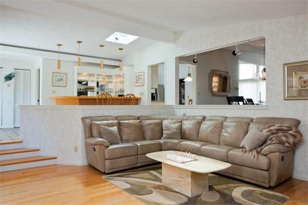7 Grace Road Newton, MA 02459 - Photo 2 of 9 a living room with furniture and kitchen view