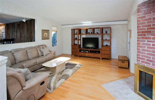 7 Grace Road Newton, MA 02459 - Photo 3 of 9 a living room with furniture and a flat screen tv