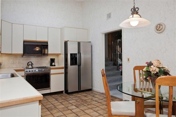 7 Grace Road Newton, MA 02459 - Photo 6 of 9 a kitchen with stainless steel appliances kitchen island granite countertop a refrigerator and a stove top oven