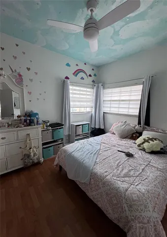 a bedroom with a bed and dresser