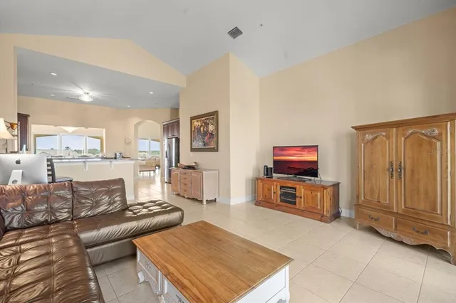 a spacious bedroom with a bed and large windows