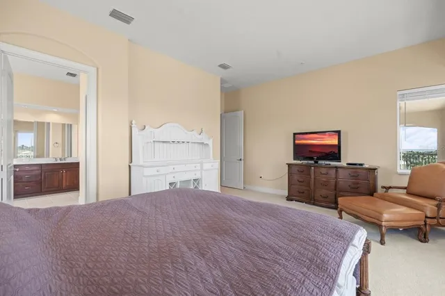 a spacious bathroom with a tub sink shower and mirror