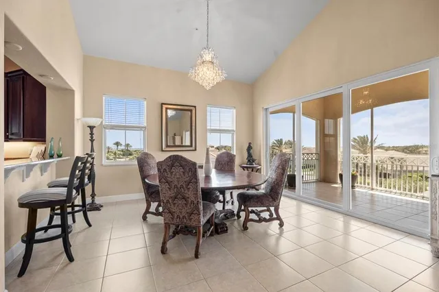 a kitchen with kitchen island granite countertop a stove sink and cabinets