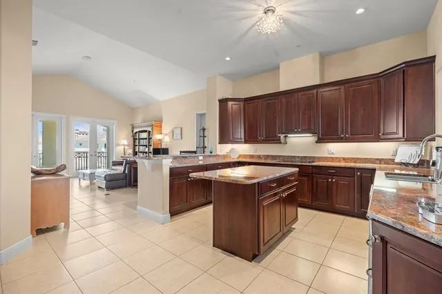 a kitchen with a sink a stove and cabinets