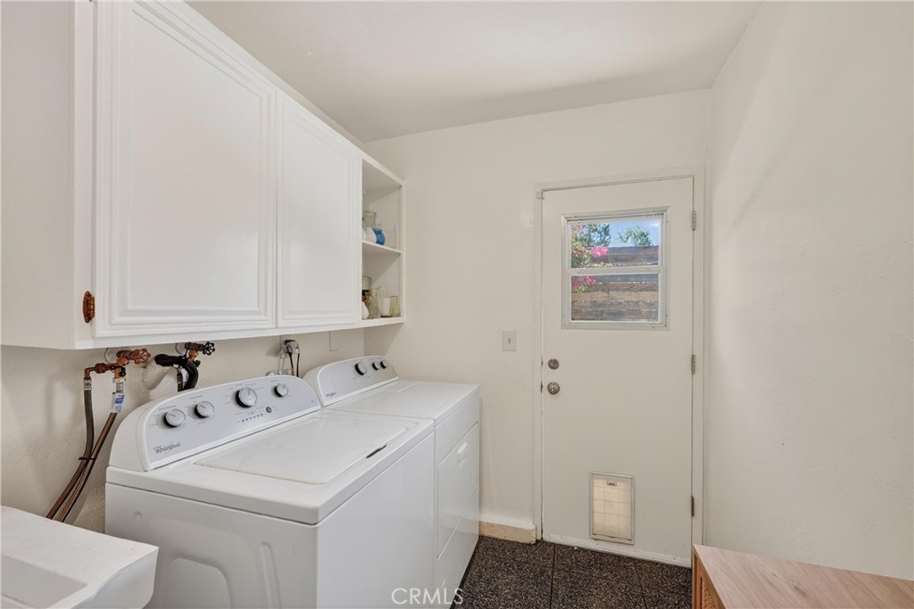 945 Le Conte Drive Riverside, CA 92507 - Photo 18 of 36 Laundry Room just outside of family room. Doggie door from previous owner. No pets at home.