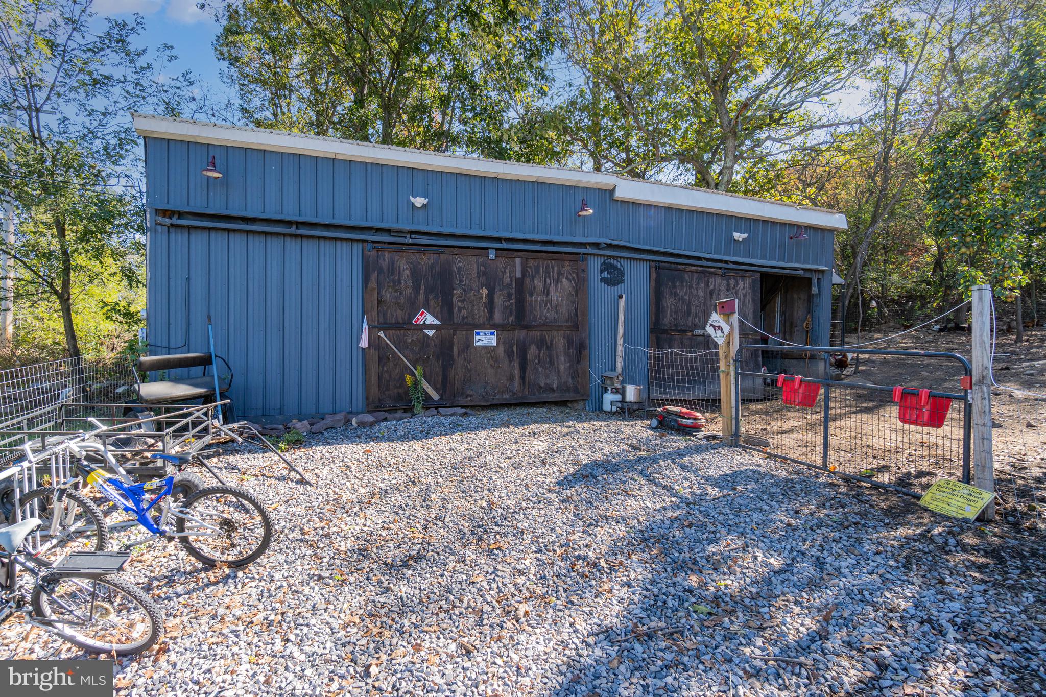 132 Turnpike Road Ashland, PA 17921 - Photo 2 of 20 a view of a house with a garage and wooden fence