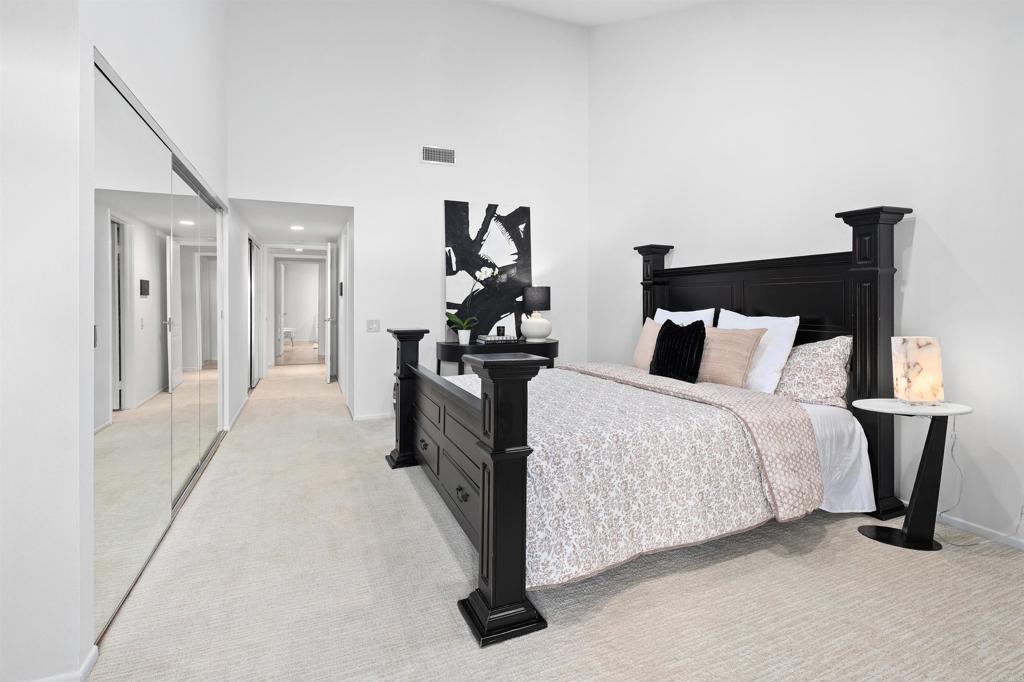 4074 Avenida Brisa Rancho Santa Fe, CA 92091 - Photo 14 of 32 a bedroom with a bed and wooden floor