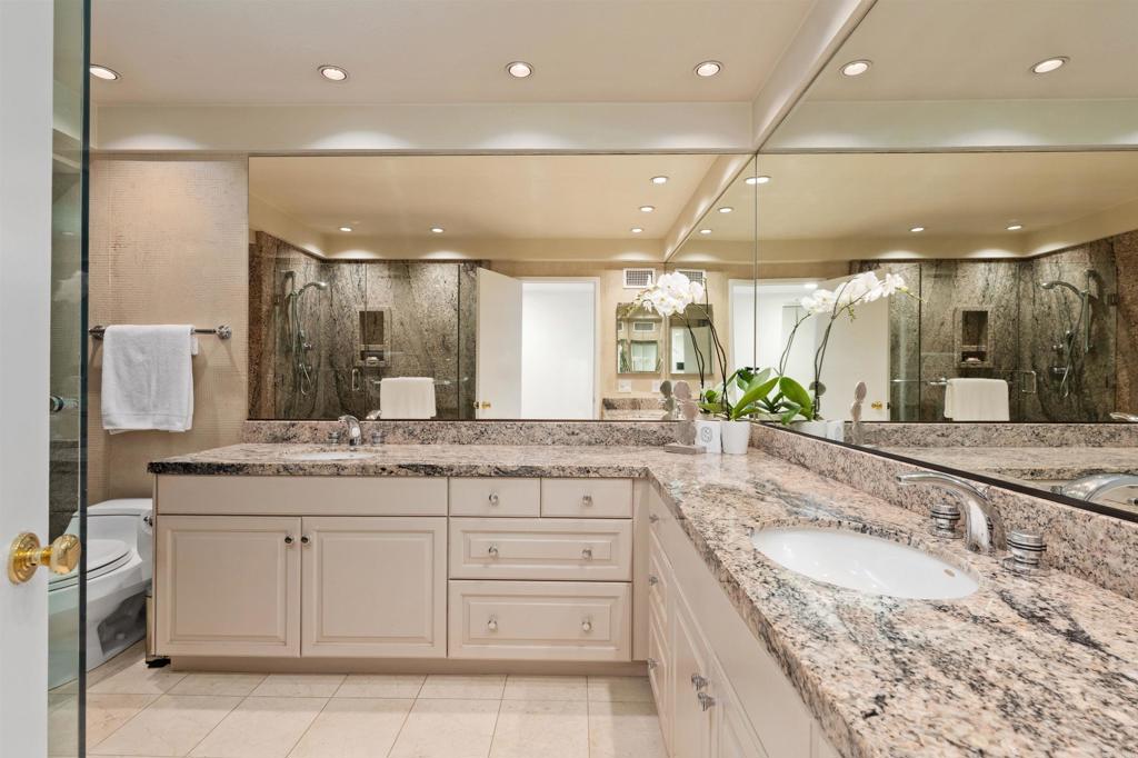 4074 Avenida Brisa Rancho Santa Fe, CA 92091 - Photo 15 of 32 a bathroom with a granite countertop sink vanity and a large mirror