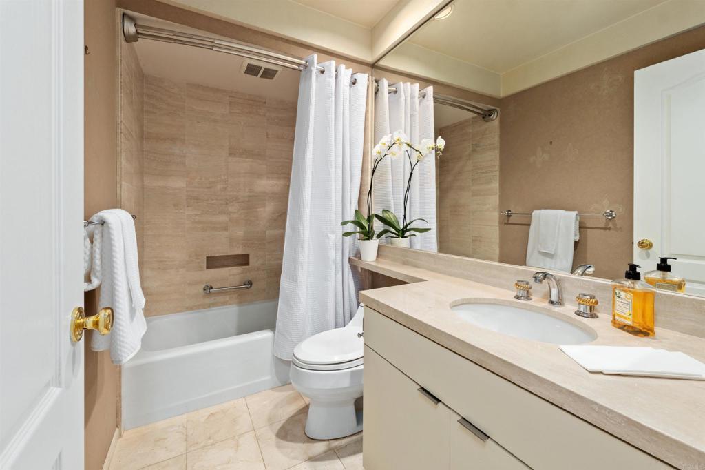 4074 Avenida Brisa Rancho Santa Fe, CA 92091 - Photo 19 of 32 a bathroom with a sink a toilet and a bathtub