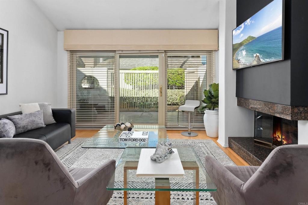 4074 Avenida Brisa Rancho Santa Fe, CA 92091 - Photo 7 of 32 a living room with fireplace furniture and a flat screen tv