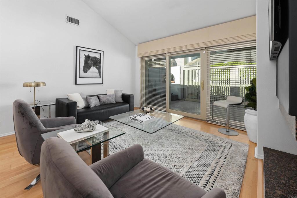 4074 Avenida Brisa Rancho Santa Fe, CA 92091 - Photo 8 of 32 a living room with furniture and a floor to ceiling window