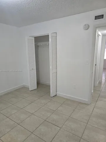 an empty room with a fireplace