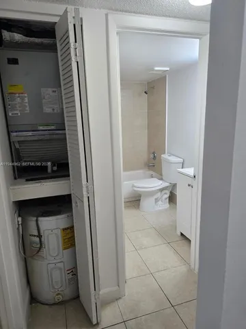a bathroom with a toilet and a vanity