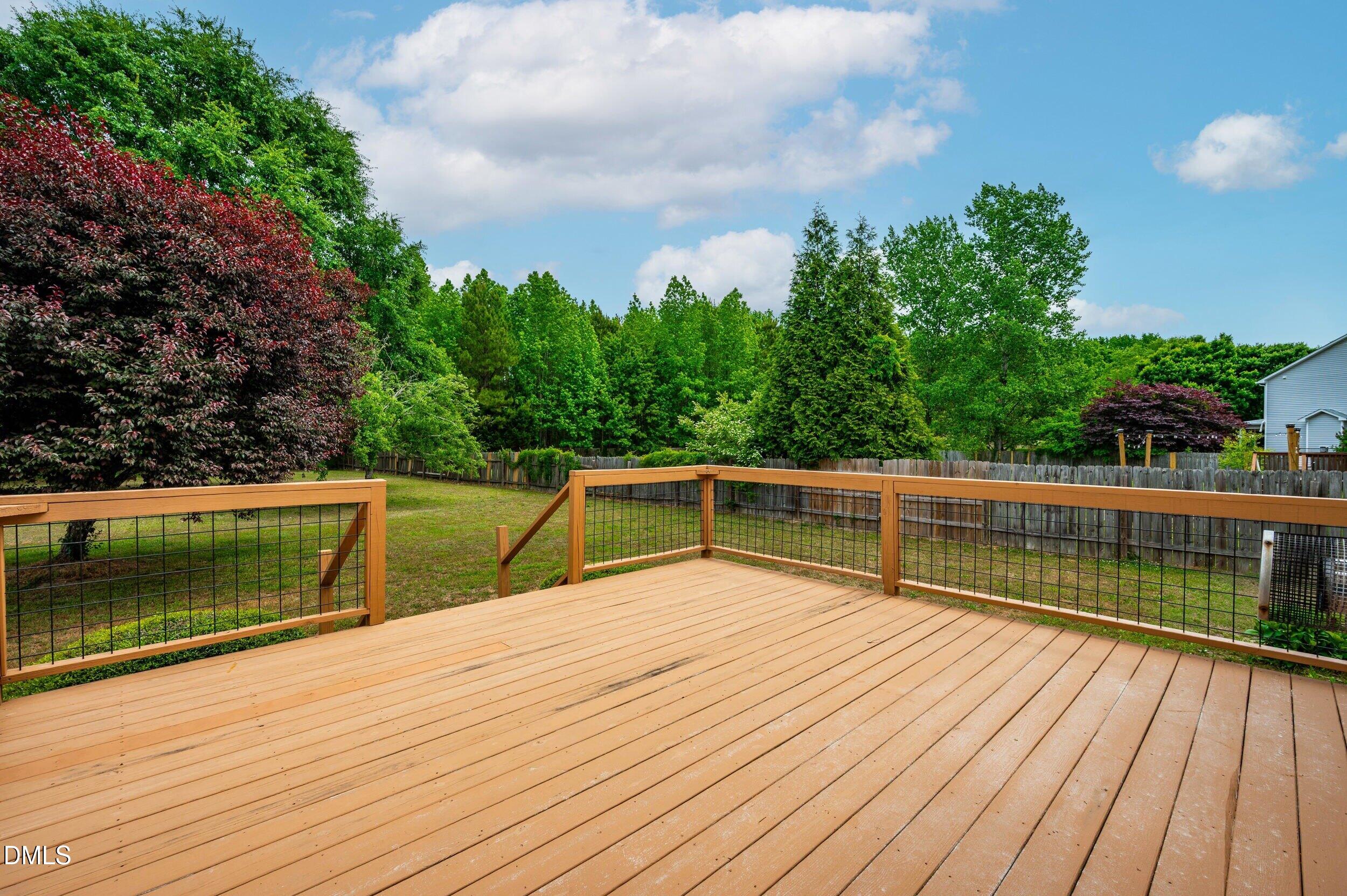 125 Rustic Lane Smithfield, NC 27577 - Photo 39 of 49 a view of balcony with wooden floor and seating space