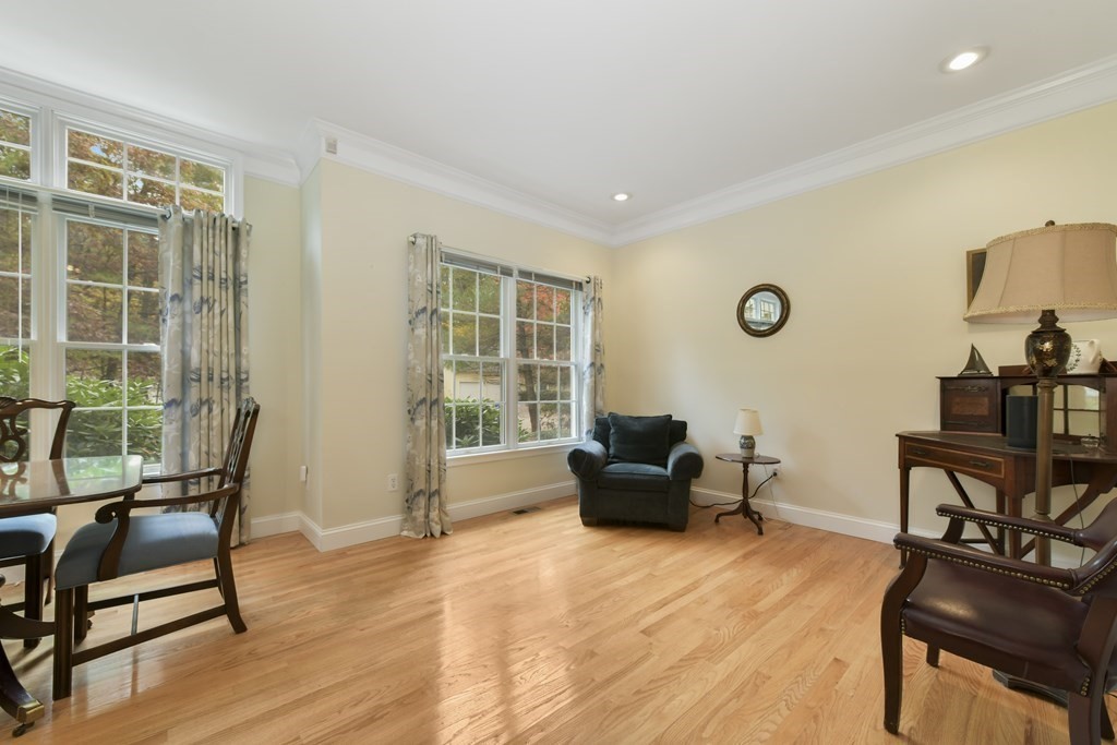 7 Moore Circle, Unit 7 Bedford, MA 01730 - Photo 12 of 27 a living room with furniture and a window