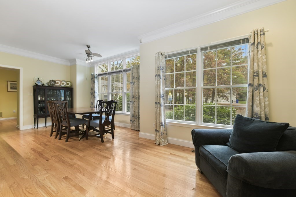 7 Moore Circle, Unit 7 Bedford, MA 01730 - Photo 13 of 27 a living room with furniture and large windows