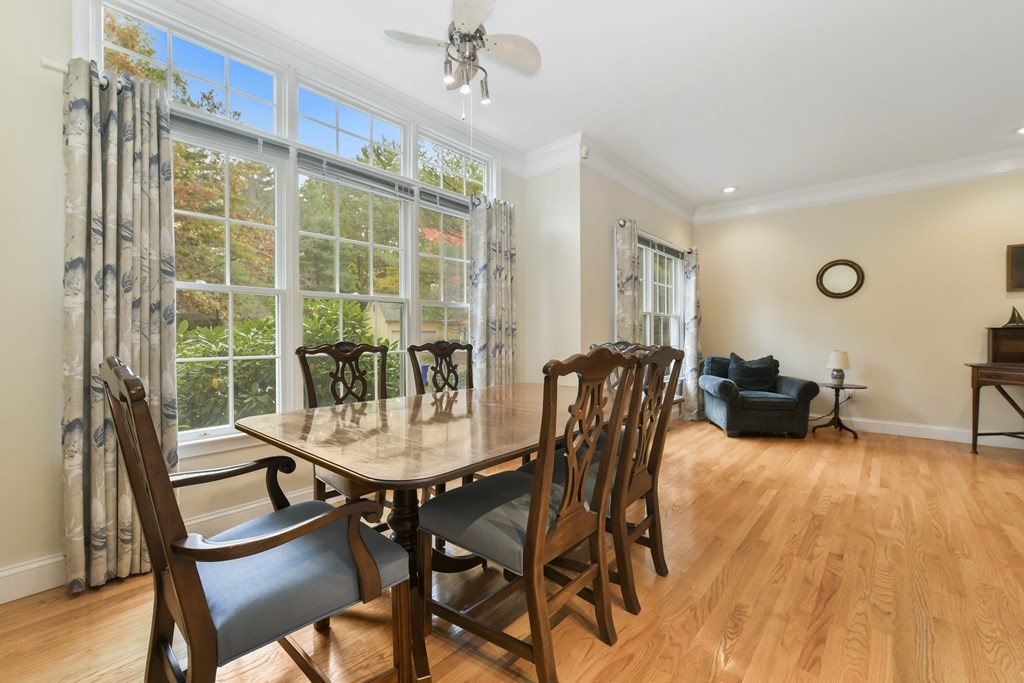 7 Moore Circle, Unit 7 Bedford, MA 01730 - Photo 14 of 27 a view of a dining room with furniture window and wooden floor