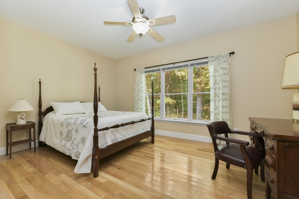 7 Moore Circle, Unit 7 Bedford, MA 01730 - Photo 15 of 27 a bedroom with a bed and a window