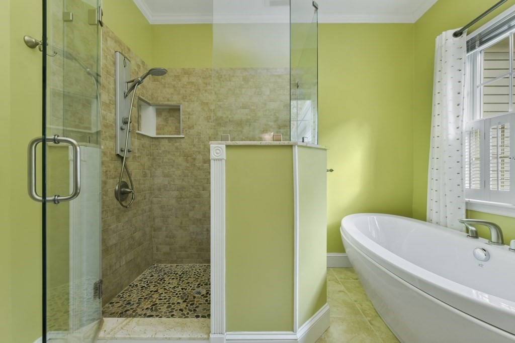 7 Moore Circle, Unit 7 Bedford, MA 01730 - Photo 19 of 27 a bathroom with a bathtub and a shower