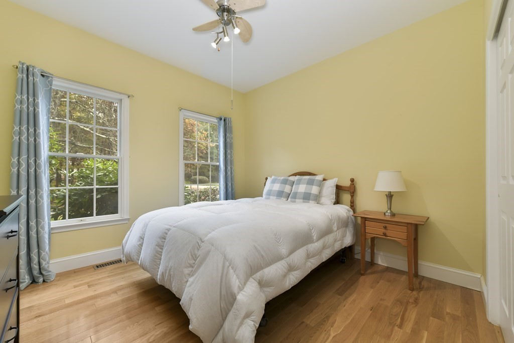 7 Moore Circle, Unit 7 Bedford, MA 01730 - Photo 20 of 27 a bedroom with a bed and window