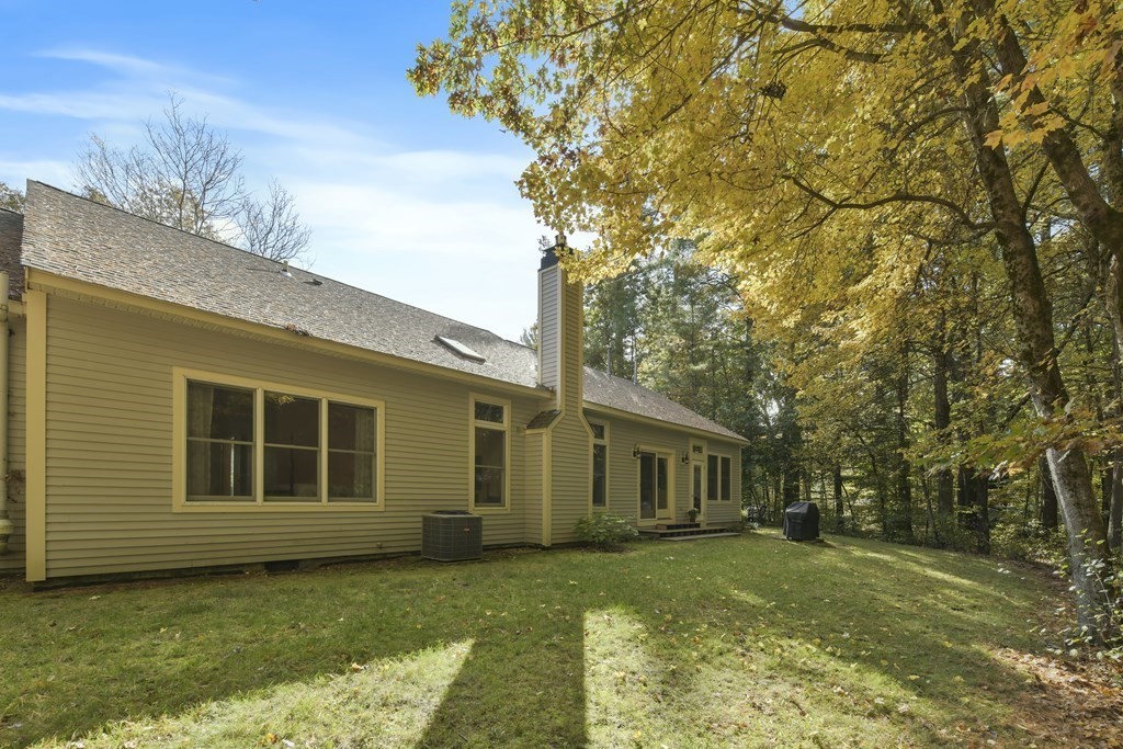7 Moore Circle, Unit 7 Bedford, MA 01730 - Photo 23 of 27 a view of a house with a yard