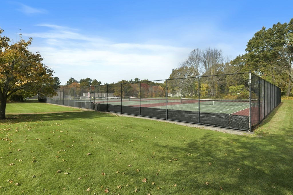 7 Moore Circle, Unit 7 Bedford, MA 01730 - Photo 26 of 27 a view of a field of grass and trees
