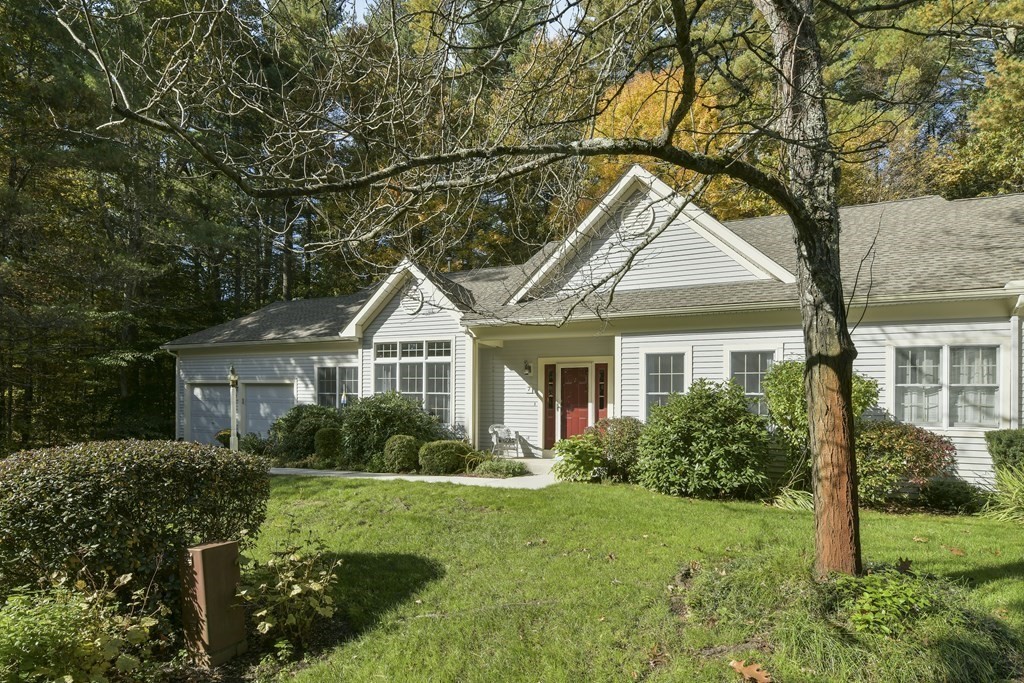 7 Moore Circle, Unit 7 Bedford, MA 01730 - Photo 3 of 27 a front view of house with yard and green space