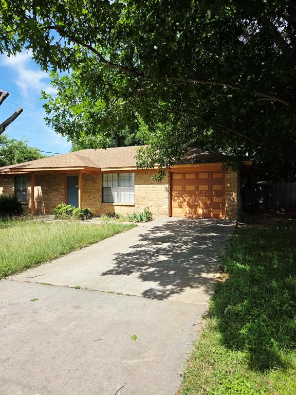 722 South Church Street Pilot Point, TX 76258 - Photo 3 of 37 a front view of a house with a garden and yard