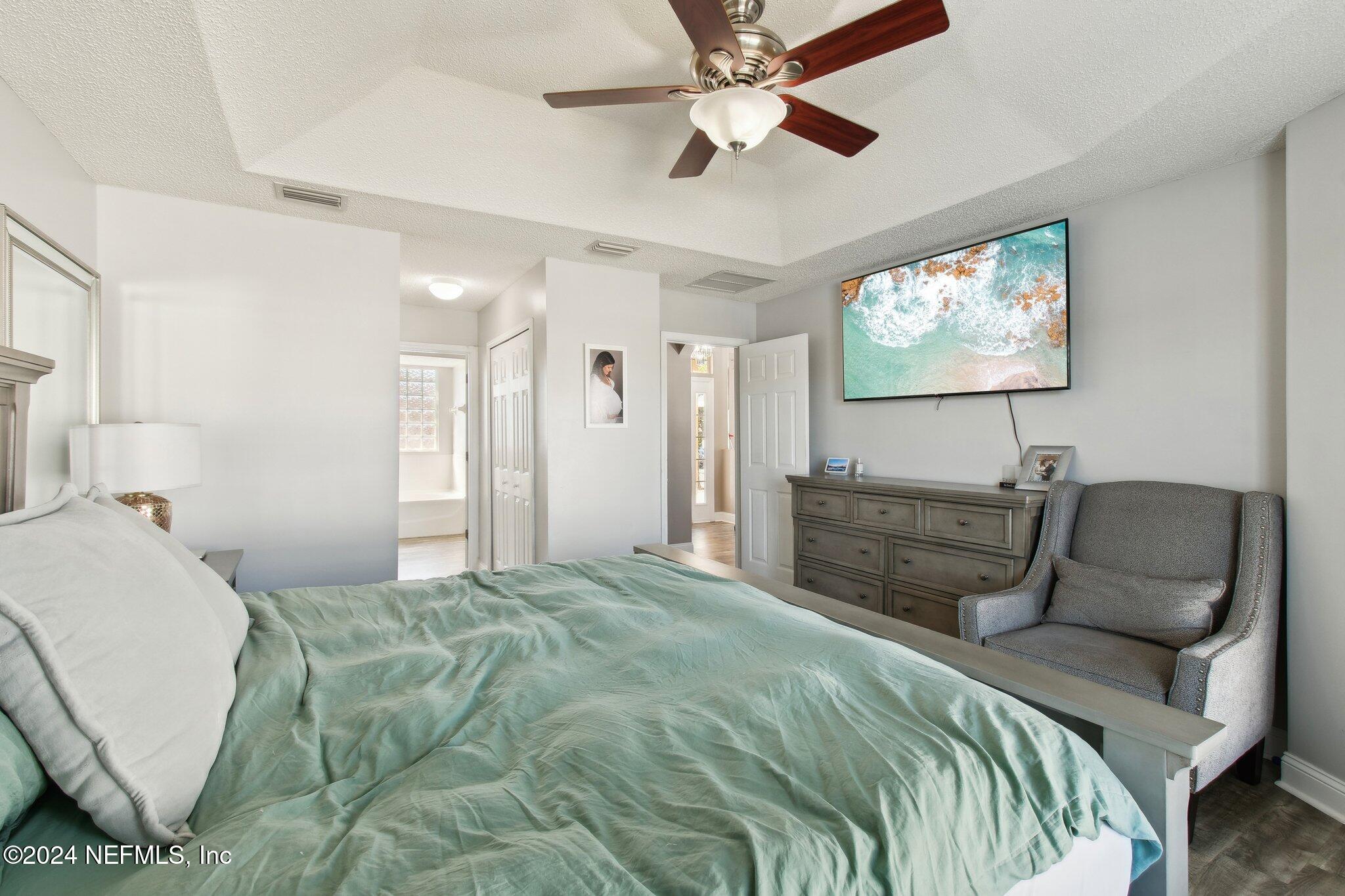 2955 Ravine Hill Drive Middleburg, FL 32068 - Photo 17 of 38 a bedroom with a bed and couch