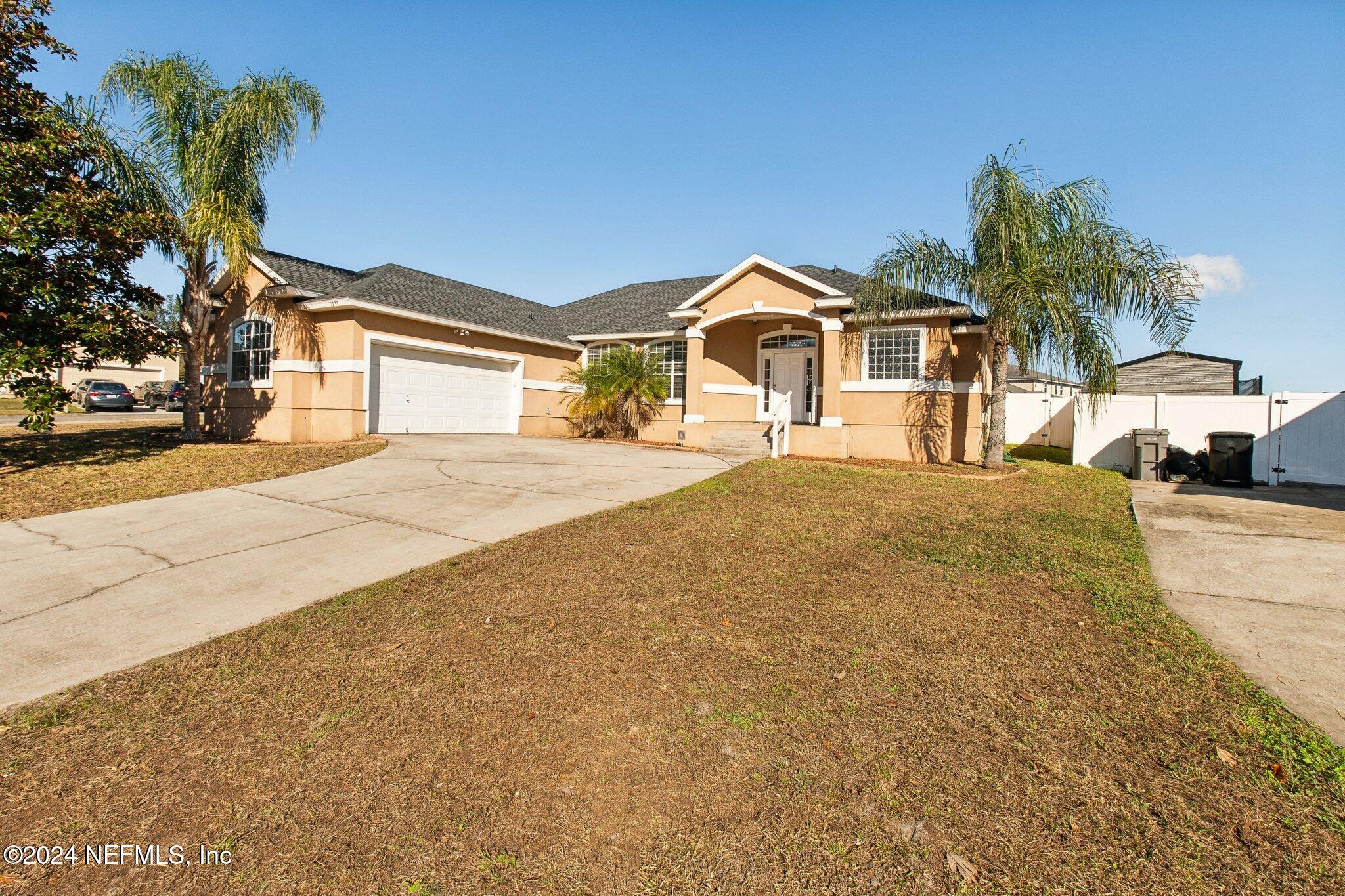 2955 Ravine Hill Drive Middleburg, FL 32068 - Photo 2 of 38 a front view of a house with a yard