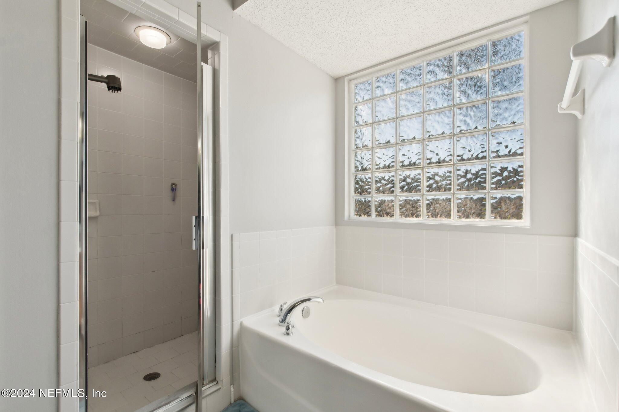 2955 Ravine Hill Drive Middleburg, FL 32068 - Photo 22 of 38 a white bath tub sitting next to a shower