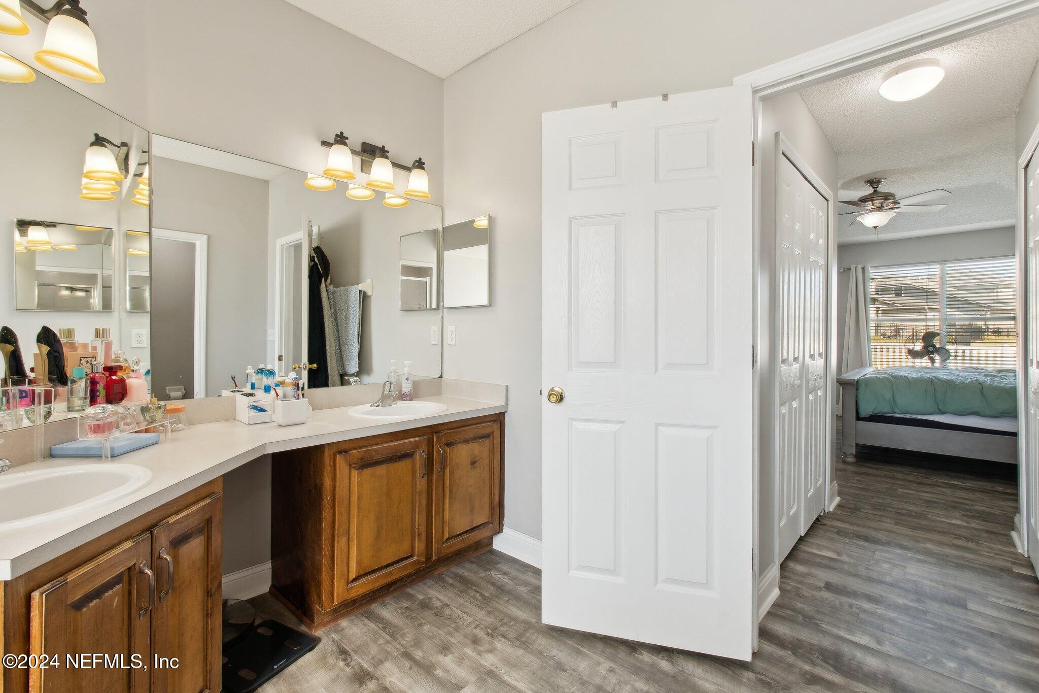 2955 Ravine Hill Drive Middleburg, FL 32068 - Photo 23 of 38 a spacious bathroom with a double vanity sink mirror and shower