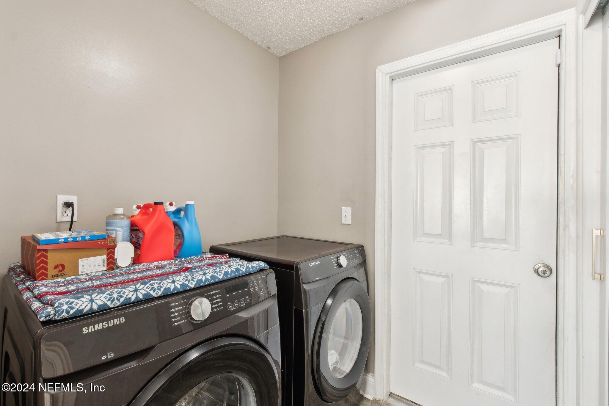 2955 Ravine Hill Drive Middleburg, FL 32068 - Photo 24 of 38 a utility room with dryer and washer
