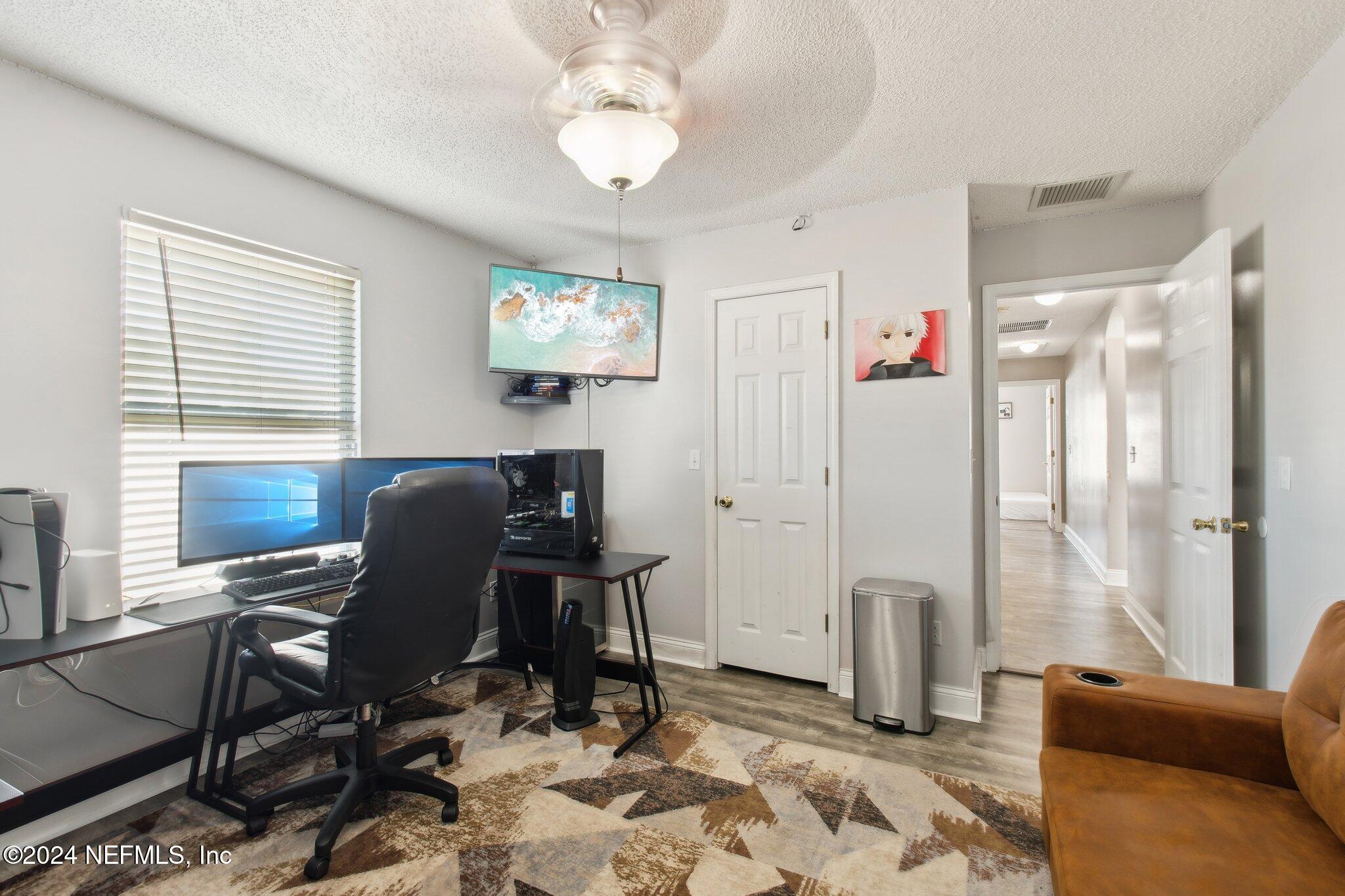 2955 Ravine Hill Drive Middleburg, FL 32068 - Photo 28 of 38 a view of a workspace with furniture and a window