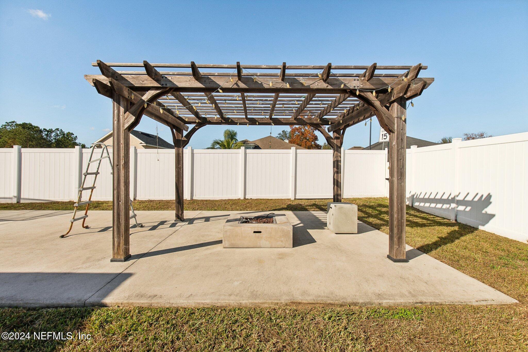 2955 Ravine Hill Drive Middleburg, FL 32068 - Photo 35 of 38 a view of a swimming pool with a patio