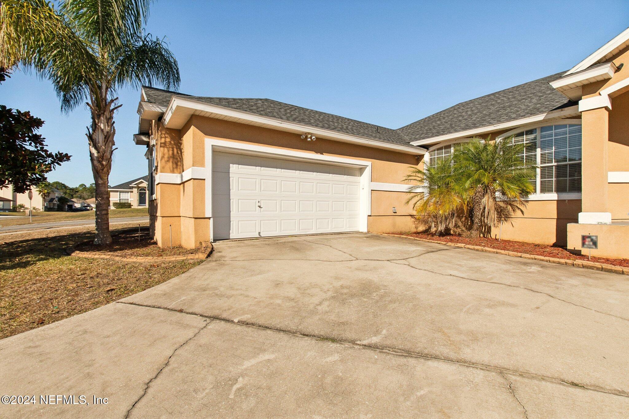 2955 Ravine Hill Drive Middleburg, FL 32068 - Photo 6 of 38 a front view of a house with a yard
