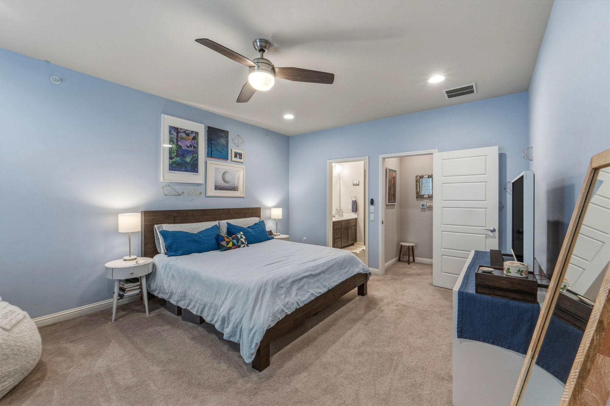 6814 East Riverside Drive, Unit 34 Austin, TX 78741 - Photo 18 of 26 a bedroom with a bed and a flat screen tv