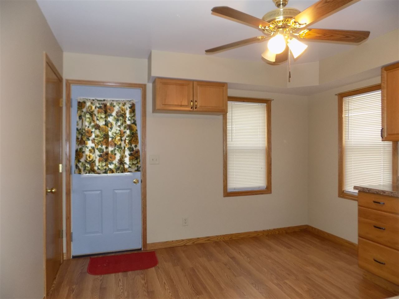 6201 Park Ridge Road Loves Park, IL 61111 - Photo 8 of 25 an empty room with windows and fan