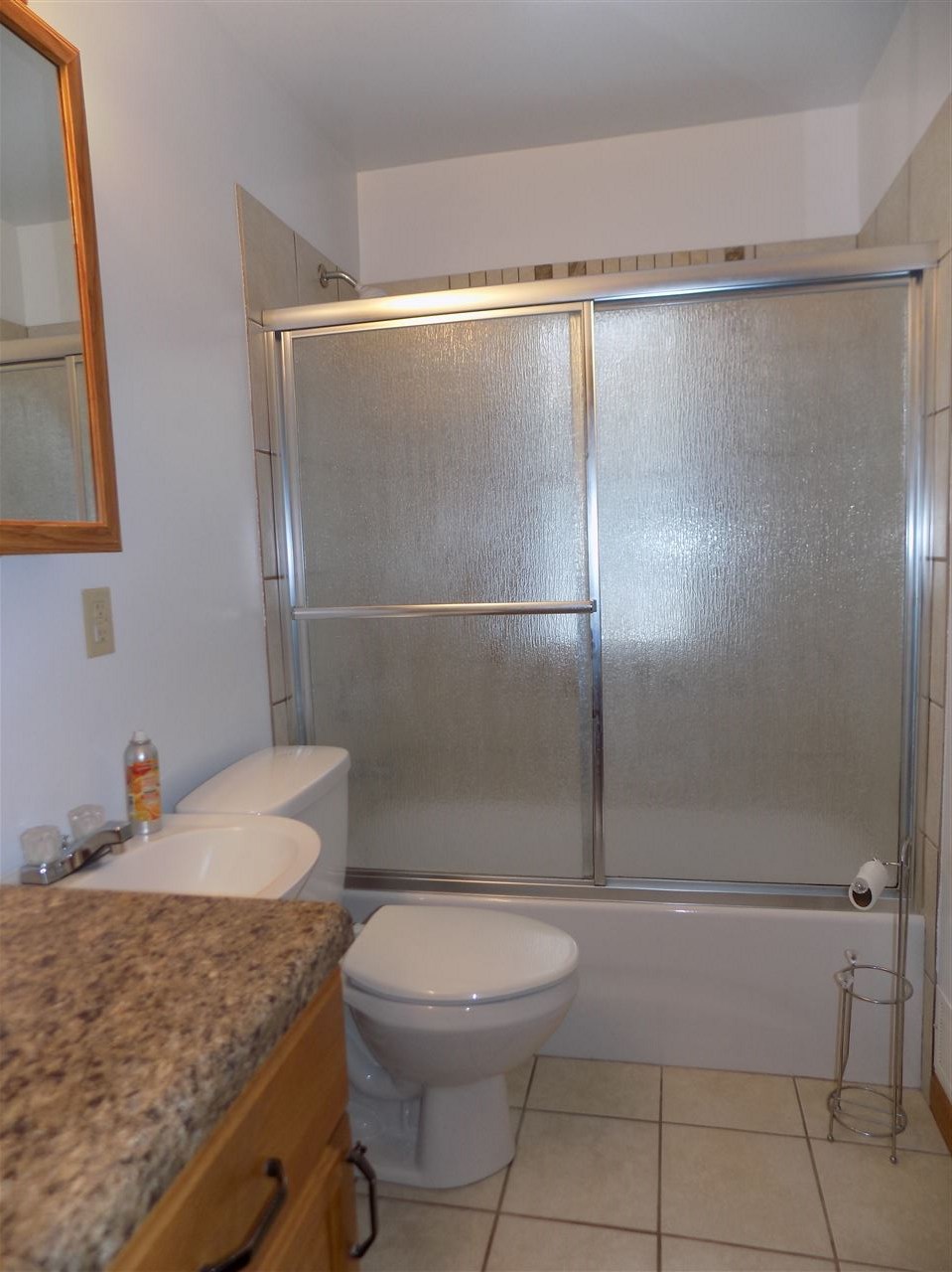 6201 Park Ridge Road Loves Park, IL 61111 - Photo 9 of 25 a bathroom with a granite countertop shower and a sink