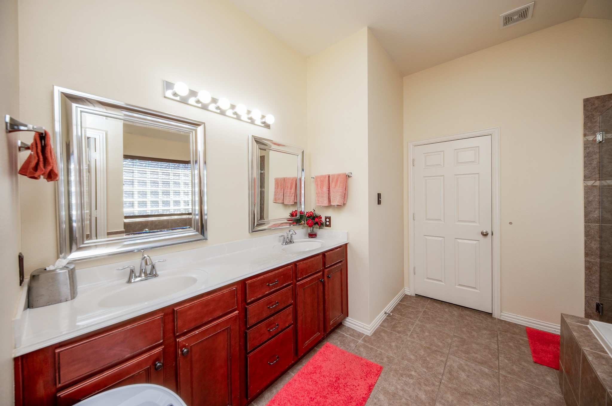 9034 Necklace Tree Lane Katy, TX 77494 - Photo 20 of 33 a spacious bathroom with a double vanity sink and a mirror