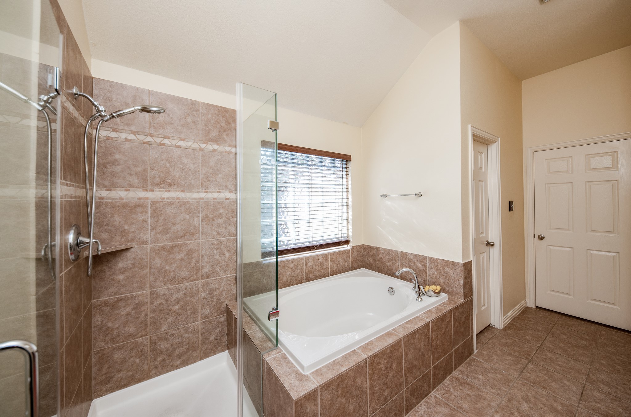 9034 Necklace Tree Lane Katy, TX 77494 - Photo 21 of 33 a bathroom with a bathtub and shower