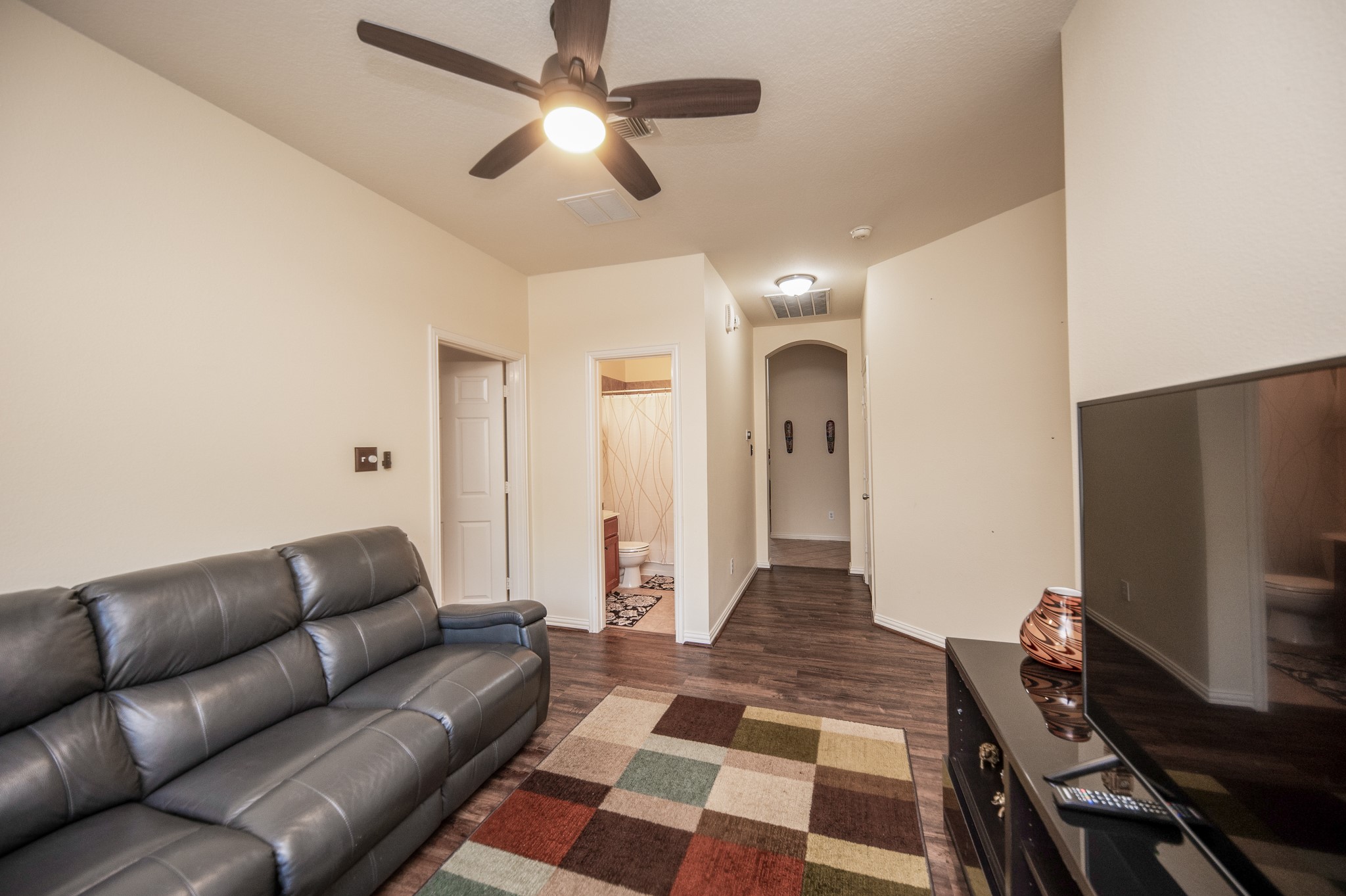 9034 Necklace Tree Lane Katy, TX 77494 - Photo 22 of 33 a living room with furniture and a flat screen tv