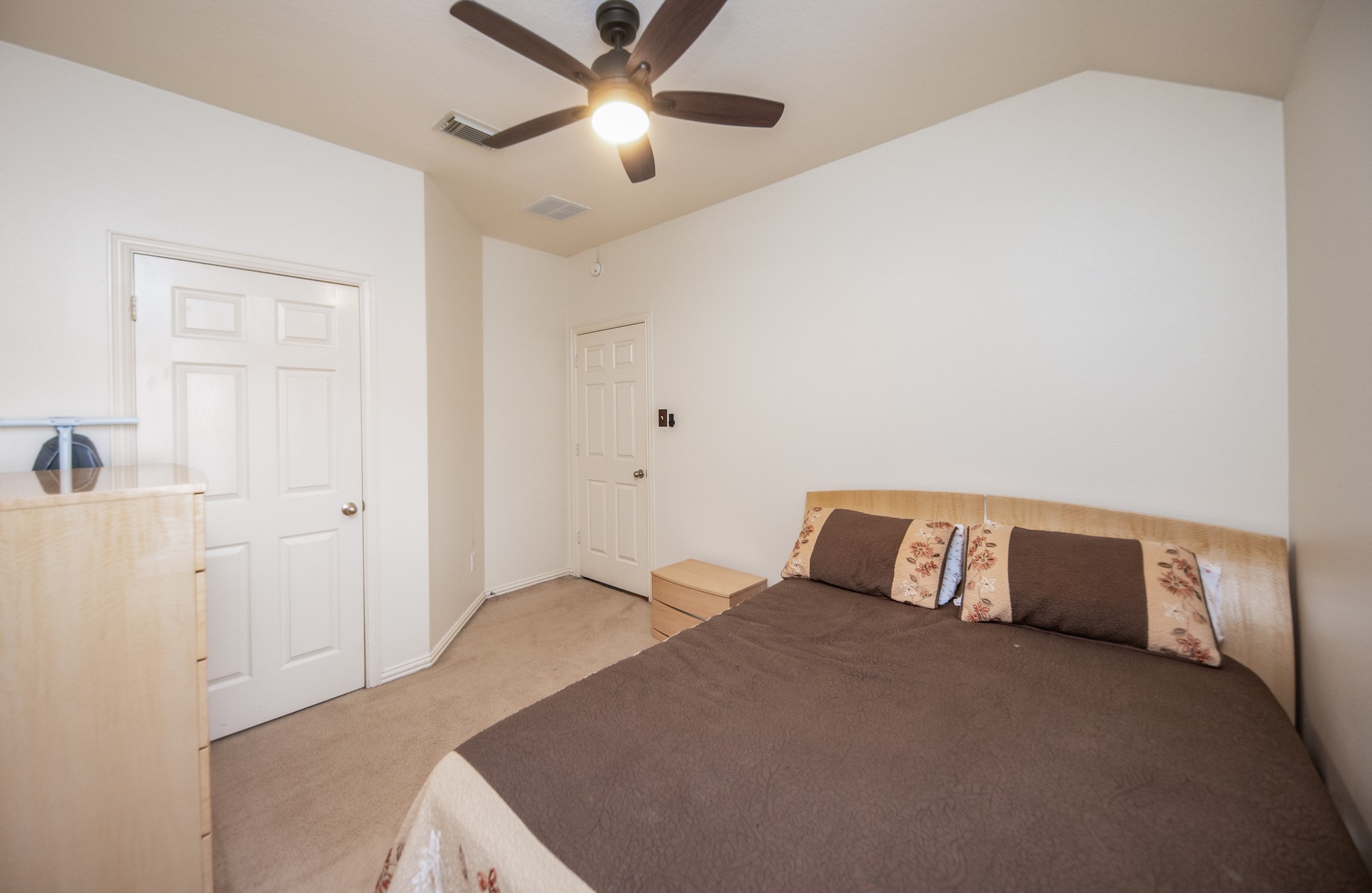 9034 Necklace Tree Lane Katy, TX 77494 - Photo 23 of 33 a bedroom with a bed and a ceiling fan