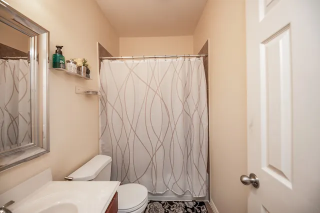 a bathroom with a sink and toilet