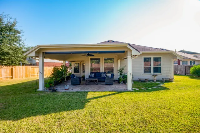 a house view with swimming pool and garden view
