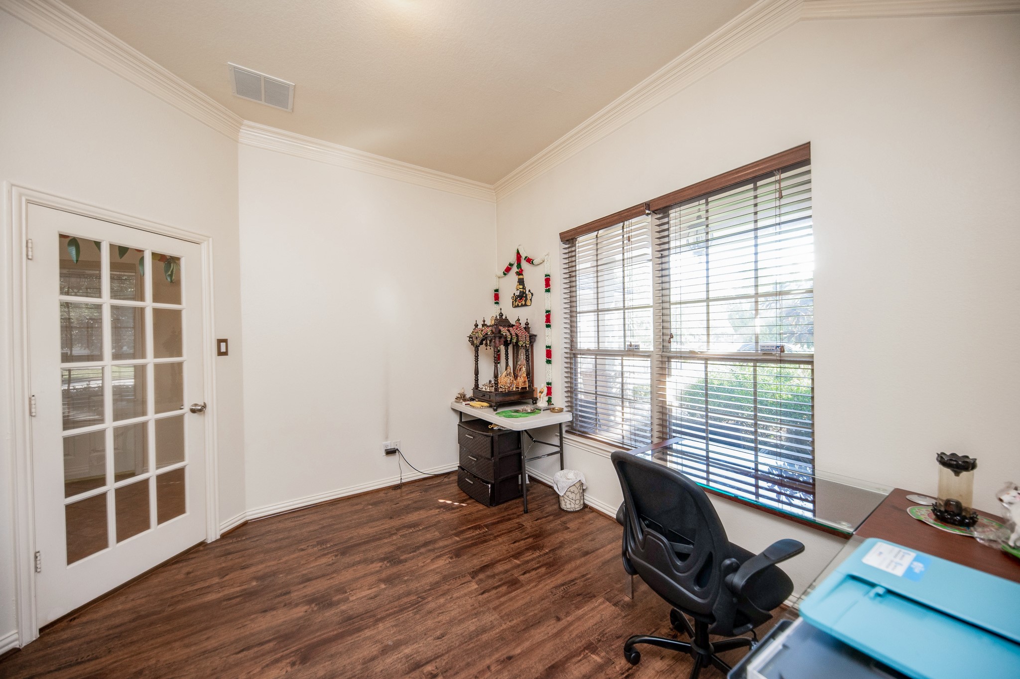 9034 Necklace Tree Lane Katy, TX 77494 - Photo 7 of 33 a view of a workspace with wooden floor and a window