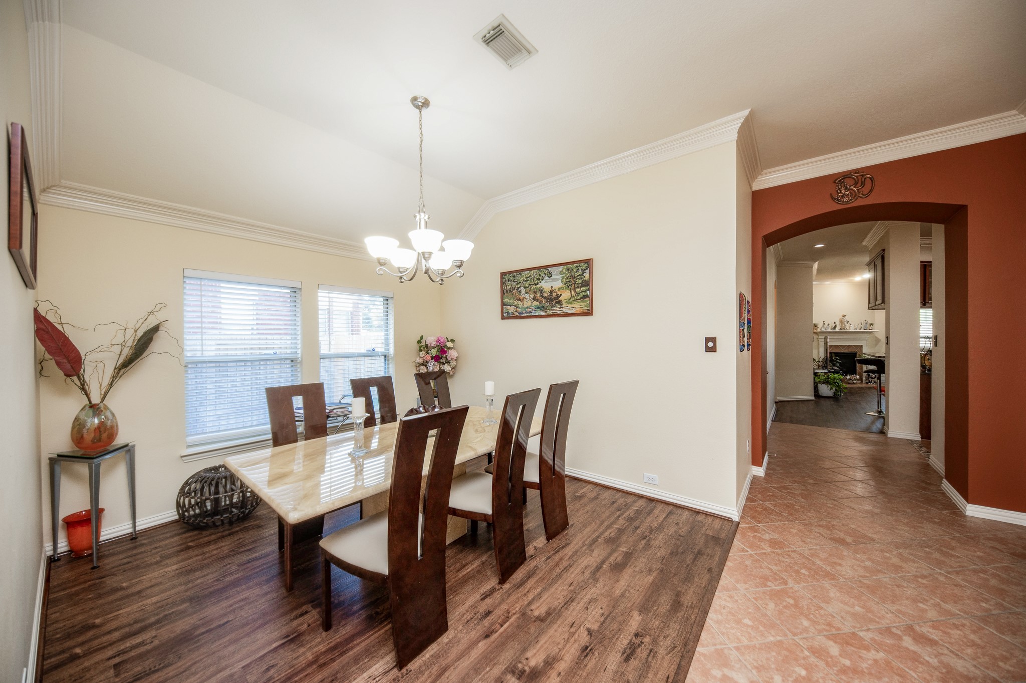 9034 Necklace Tree Lane Katy, TX 77494 - Photo 8 of 33 a view of a dining room with furniture and wooden floor
