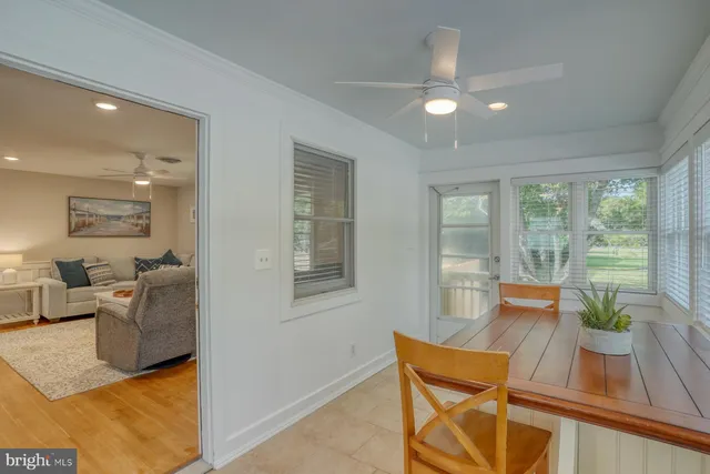 a reading room with furniture and wooden floor
